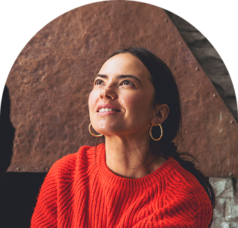 Woman smiling in a red sweater
